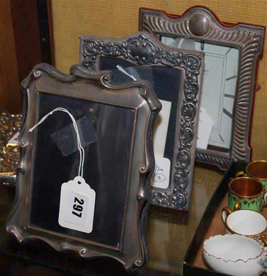 Two silver photo frames and a silver-cased clock